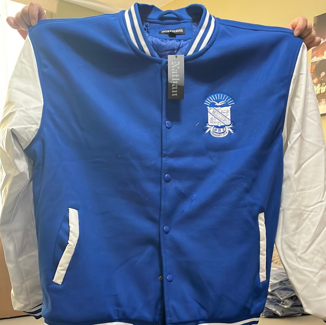 Rep your Sigma pride in this standout Letterman Jacket featuring bold royal blue body and crisp white vegan-leather sleeves. Designed with classic varsity detailing and a clean fraternity-inspired chest emblem, this jacket delivers both style and comfort. Perfect for chapter events, tailgates, or everyday Fraternity looks.