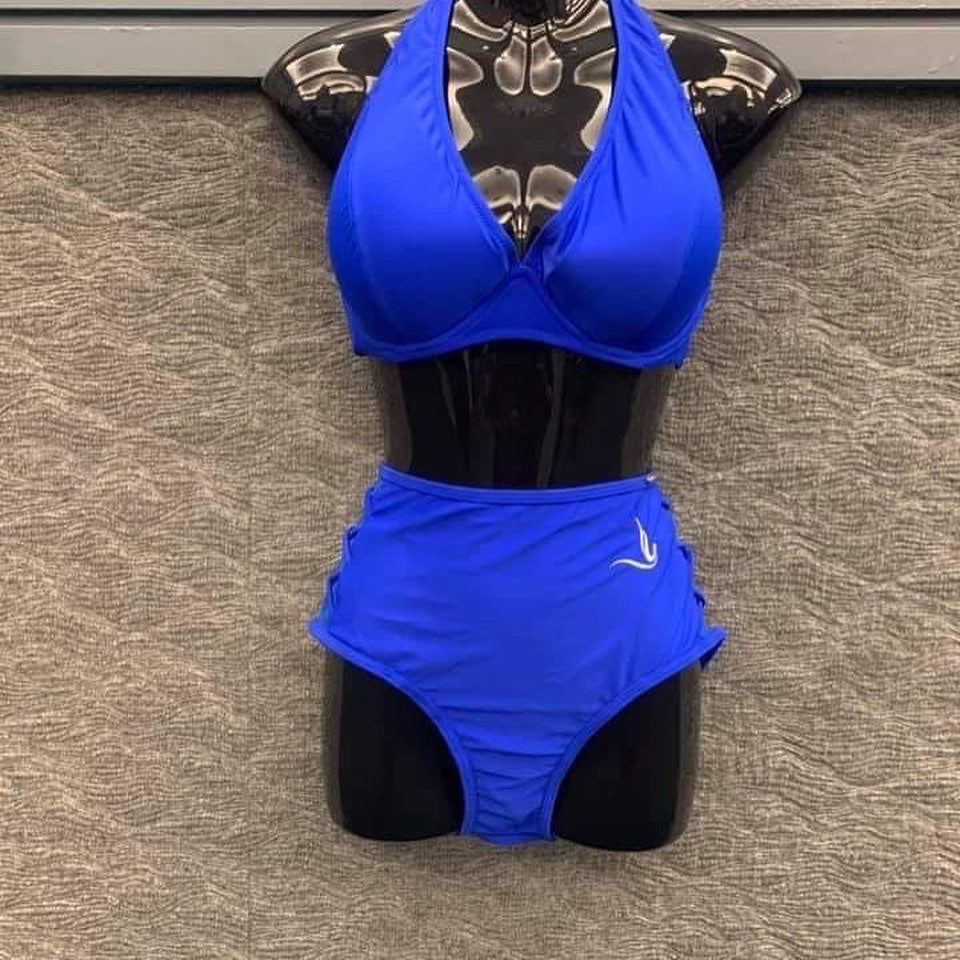 Two-piece royal blue bathing suit featuring a stylish dove detail on the left hip. High-waisted bottoms with a mesh crisscross design add a trendy flair, while the soft, wire-free fabric ensures comfort and ease. Check the size chart before ordering. Final sale.