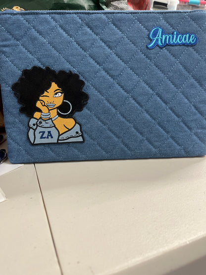 The Amicae Denim clutch