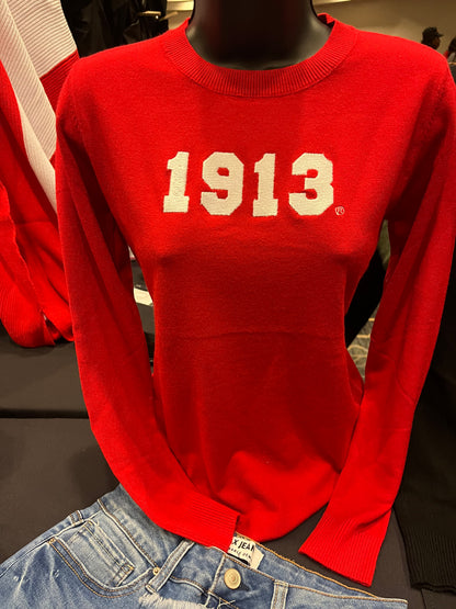 Red Delta Sigma Theta sweater with a luxurious cashmere-like feel, featuring “1913” in white across the front and ΔΣΘ etched on the sleeve. Soft, comfortable, and perfect for showing sorority pride in style.