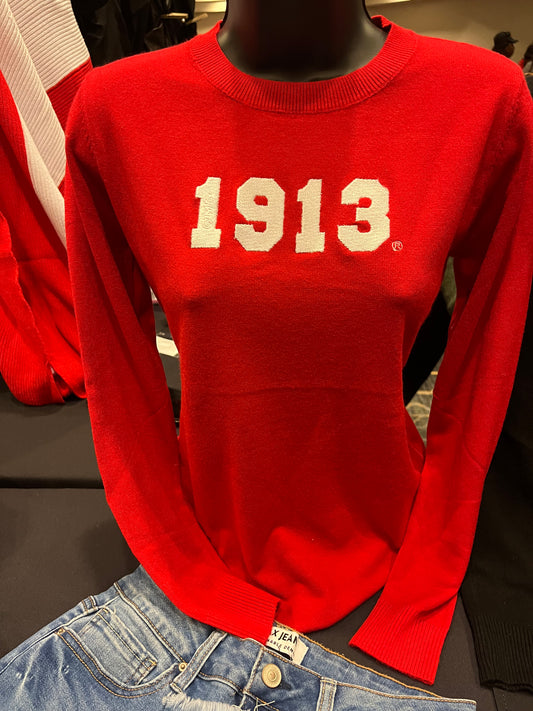 Red Delta Sigma Theta sweater with a luxurious cashmere-like feel, featuring “1913” in white across the front and ΔΣΘ etched on the sleeve. Soft, comfortable, and perfect for showing sorority pride in style.