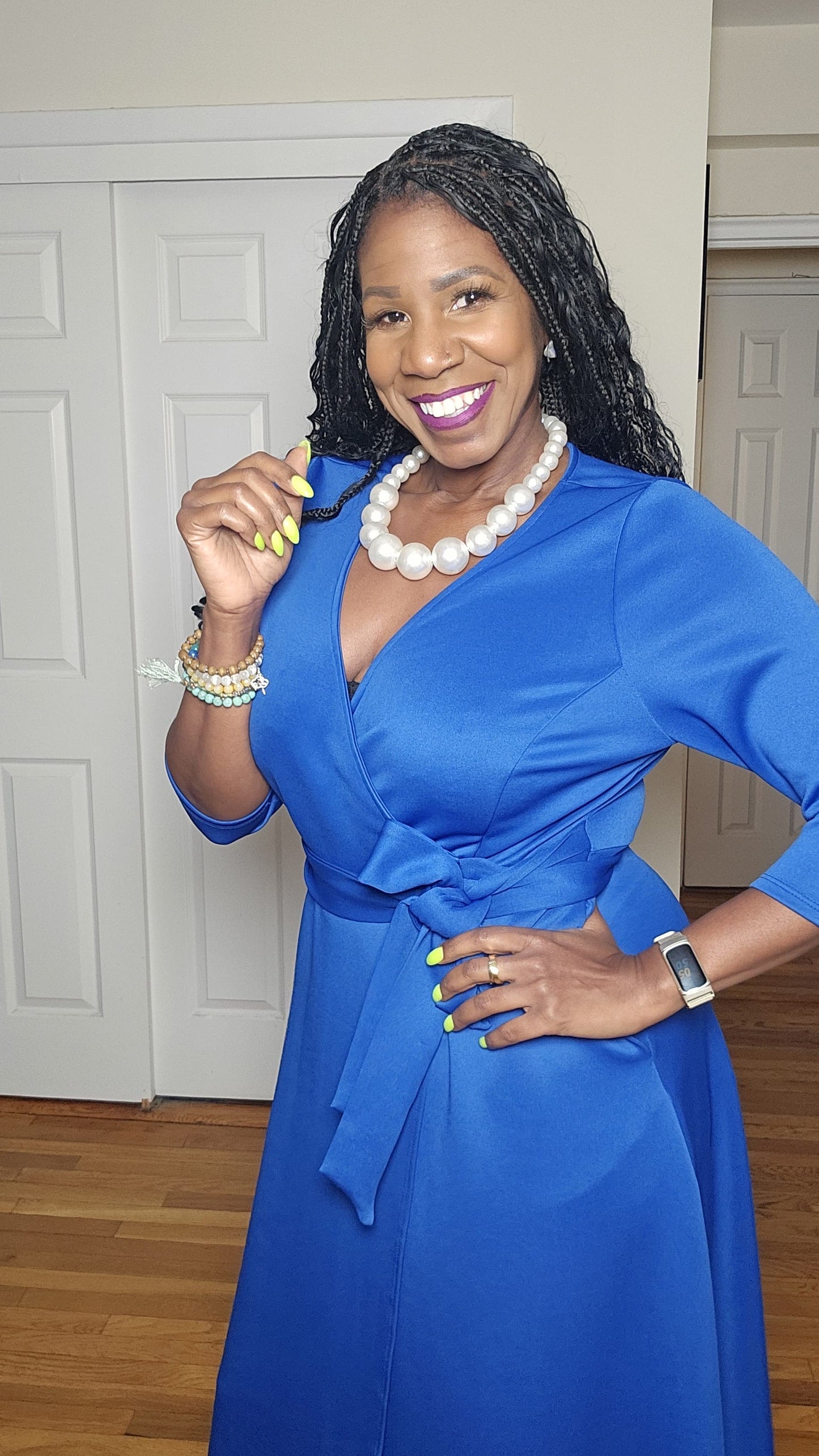 Woman in a blue zeta phi beta dress with belt