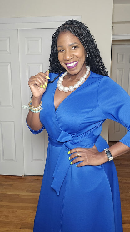 Woman in a blue zeta phi beta dress with belt
