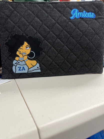 The Amicae Denim clutch