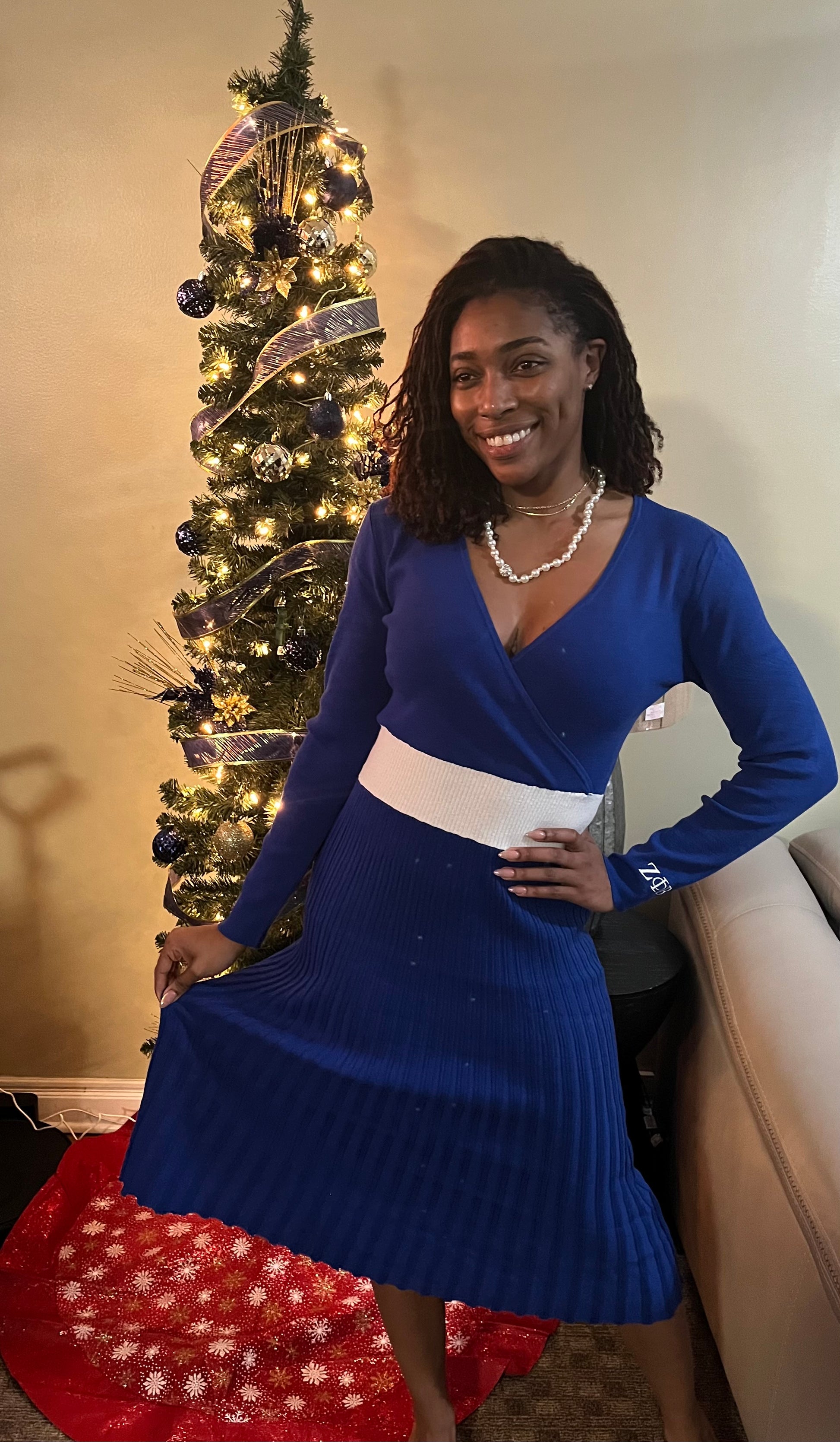 A chic midi sweater dress with a flattering V-cut neckline and ZΦΒ embroidered detailing on the sleeve for a subtle touch of Finer Womanhood. Soft, comfortable, and perfect for elevating your Greek look whether you’re headed to an event, brunch, or a night out.