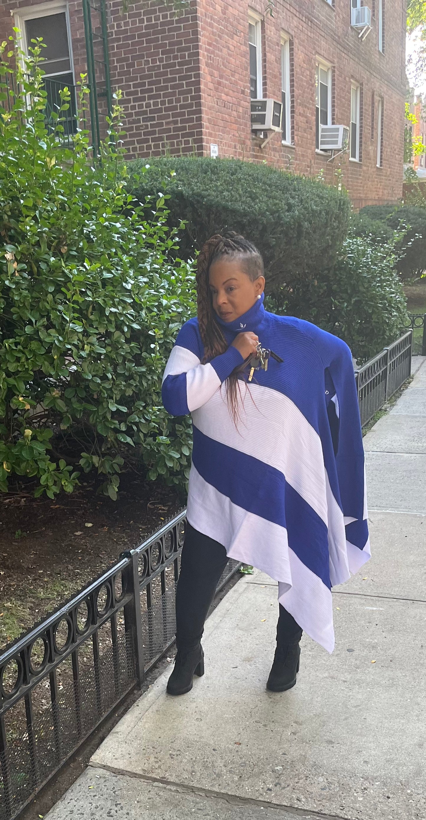 Stand out in the Asymmetrical Dove Sweater, a bold one-sleeve design made for the diva in you. This unique sweater features one bare side and one full sleeve, offering a stylish, eye-catching look. Available in two one-size options regular and plus to ensure a comfortable, flattering fit.