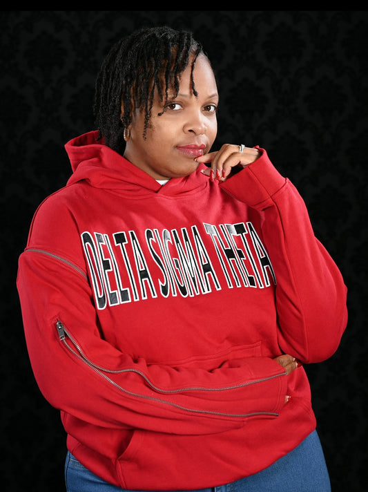 The Baddie Zippered Sweatshirt is a high-quality hoodie designed with an oversized fit for that bold, relaxed DST look. Both sleeves fully detach for versatile styling. Finished with leather Greek letters across the front for a luxe Delta touch.