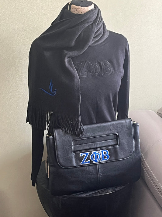 Black-on-black Zeta Phi Beta sweater with luxurious cashmere-like fabric and bold ZPB embroidery across the chest. True-to-size fit for everyday comfort and style. Collar sold separately for a customizable look.