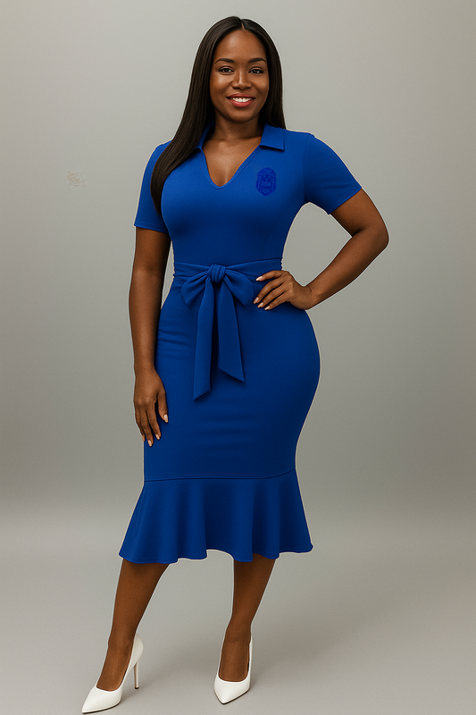 Woman wearing a royal blue zeta phi beta inc. dress with a belt