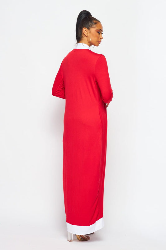 Step out in style with the Dusted with Red Duster featuring the iconic Delta DST symbol. This lightweight duster with convenient pockets is perfect for layering over any outfit, combining comfort, function, and Sorority pride.