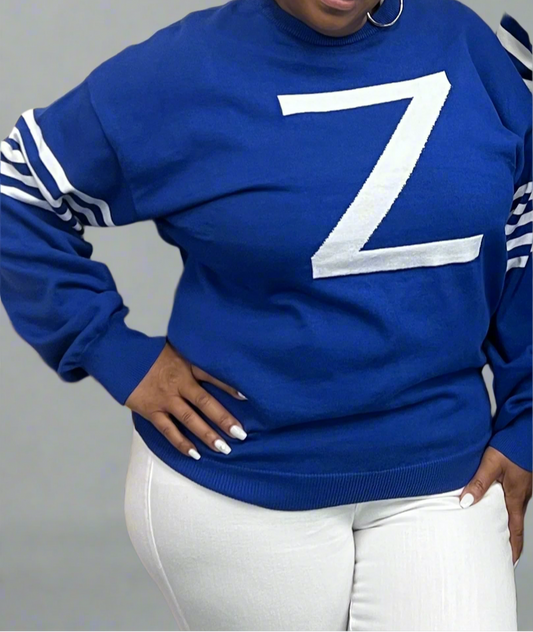 The Flashback Sweater is the first release in our Sweetest Version collection for the women of Zeta Phi Beta. These lightweight knit features five detailed lines honoring the Five Founders and a jacquard “Z” design. The back reads “the sweetest version,” with a true-to-size fit.