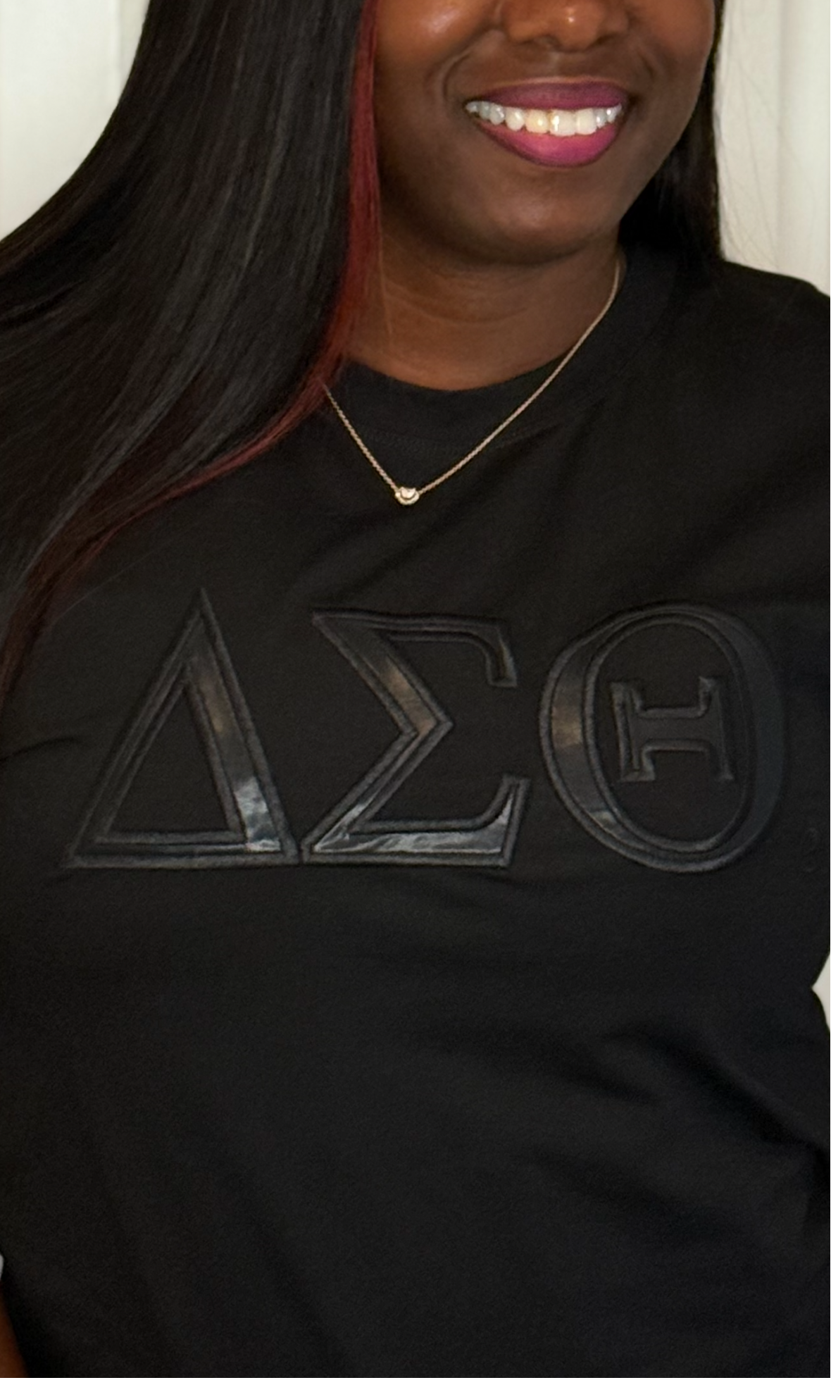 The Leather Blackout T-Shirt is a stretchy cotton–spandex blend designed for comfort and style. Faux leather lettering adds a bold Delta statement to the front. Fits true to size for a flattering, everyday wear.