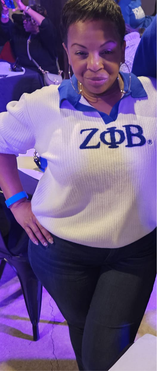 The Oversized Varsity Sweater features a relaxed white fit with a bold Zeta logo across the chest. Designed with a royal-blue collar for a classic varsity touch. Perfect for Finer women who love a comfy, laid-back look.