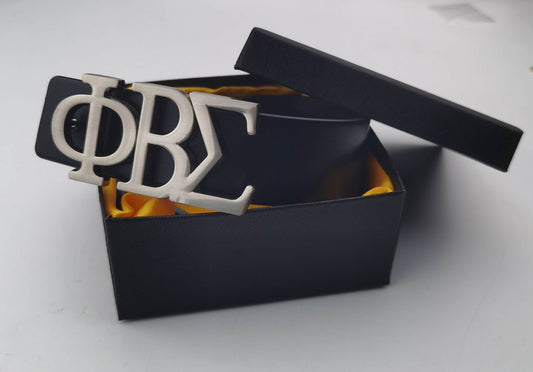 Elevate your Fraternity style with this designer Phi Beta Sigma Name Belt, featuring a bold stainless steel ΦΒΣ buckle paired with a sleek leather strap. Durable, polished, and statement-making, it’s the perfect accessory for conferences, chapter events, or everyday Sigma pride.