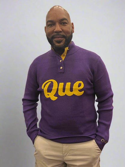 This Que Button Up Sweater comes in rich royal purple with gold suede elbow patches and a suede inlay beneath the gold neck buttons. The front features bold chenille lettering for a classic Omega look. Finished with ΩΨΦ embroidery on the left lower sleeve, it’s the perfect statement.