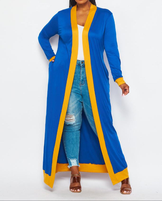 The Rho Duster is a long, royal-blue layering piece with bold yellow trimming. It fits true to size for an easy, flattering silhouette. Perfect for any SGRHO look that needs a little extra flair.