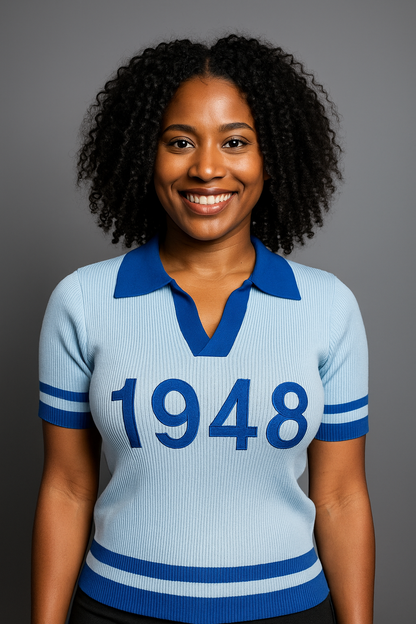 Woman wearing a light blue knit polo with '1948' for Zeta Amicae