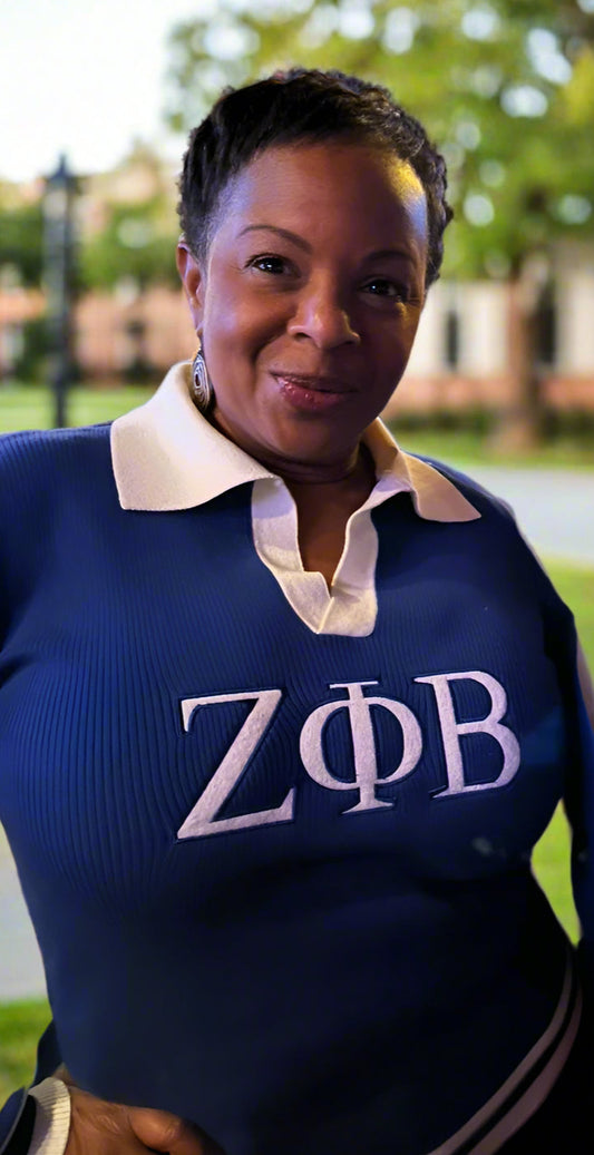 The School Girl Sweater is a royal-blue light knit with a classic white collar for a polished, preppy Zeta look. Soft, stylish, and easy to pair with skirts or slacks. Fits true to size for a comfortable, flattering wear.