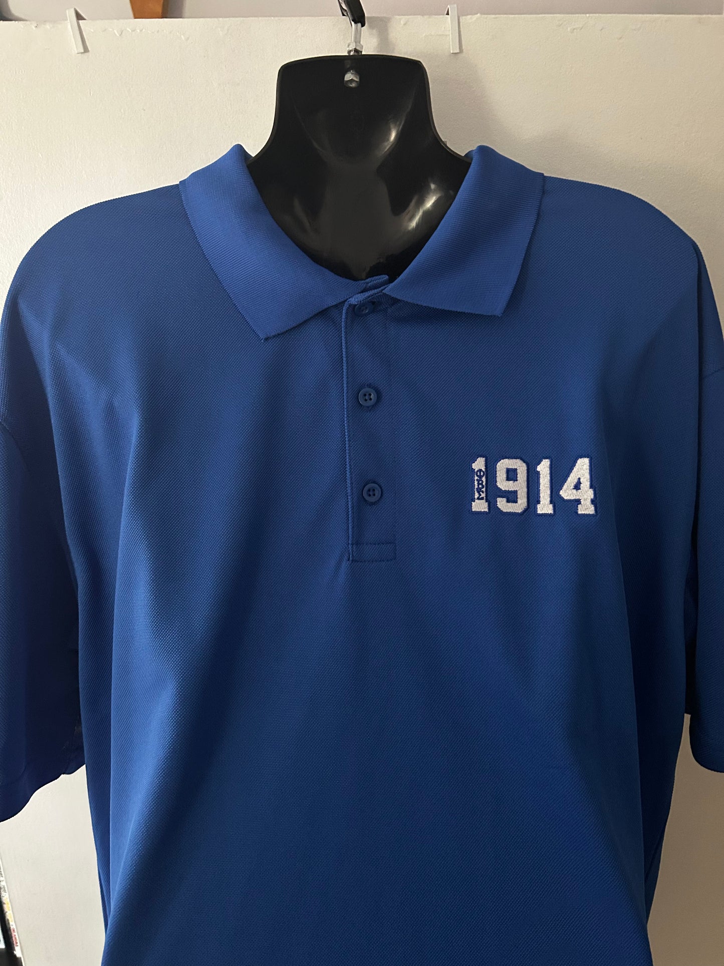 Show your Sigma pride in this classic 1914 Polo, designed in a rich royal blue with a clean embroidered style “1914” detail on the chest. Lightweight, breathable, and perfect for chapter events, conferences, or everyday Fraternity style. A timeless, comfortable piece every Sigma man can wear with confidence.