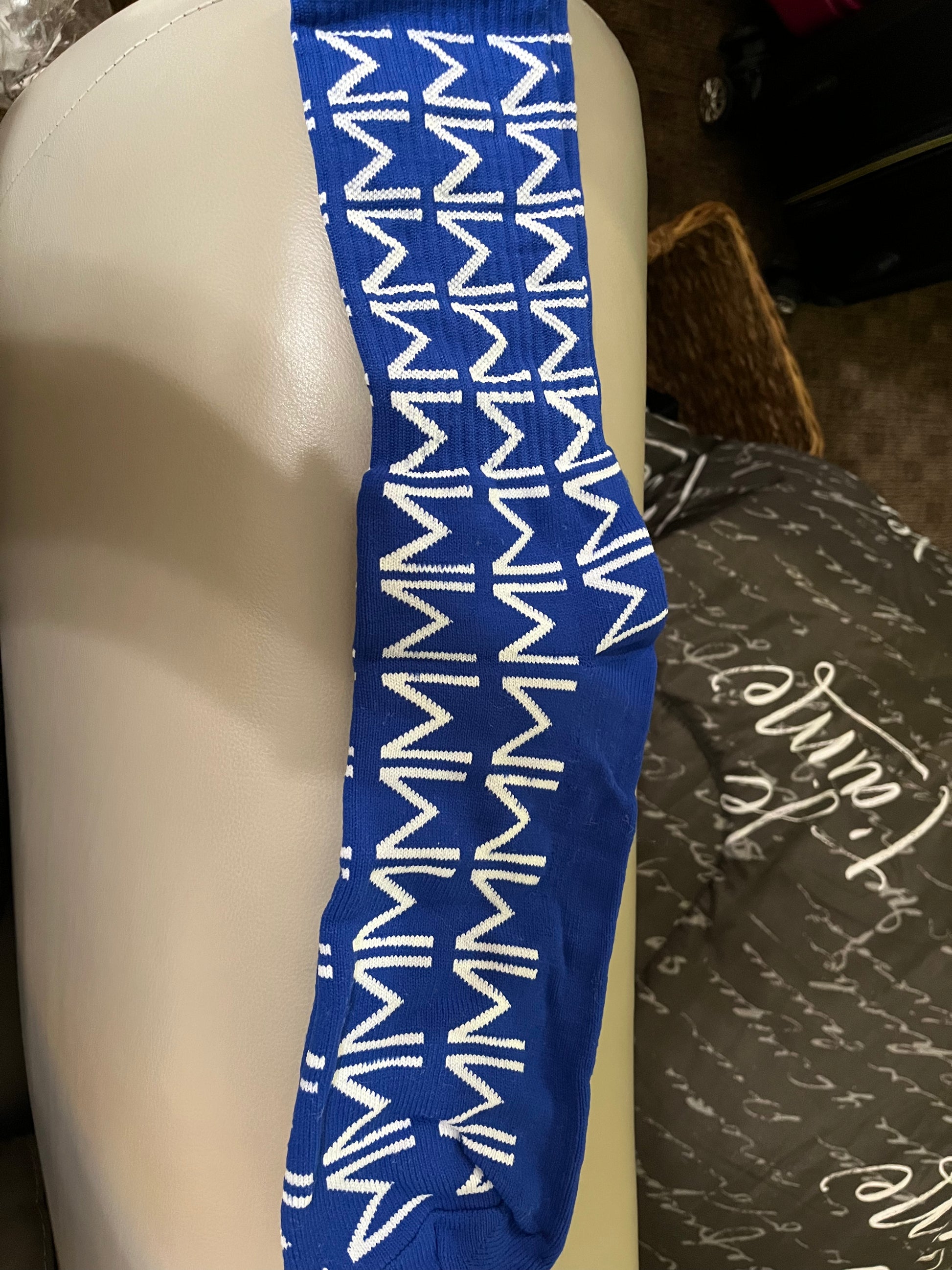 Step out in comfort and Fraternity pride with these long blue Sigma Socks, featuring white Sigma symbols patterned throughout. Soft, stylish, and perfect for everyday wear, meetings, or adding a subtle touch of Sigma spirit to any outfit.