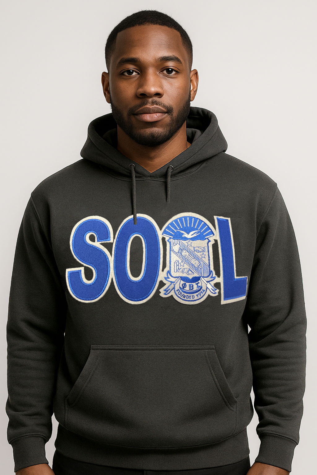 Man wearing a black Phi Beta Sigma 'SOUL' hoodie