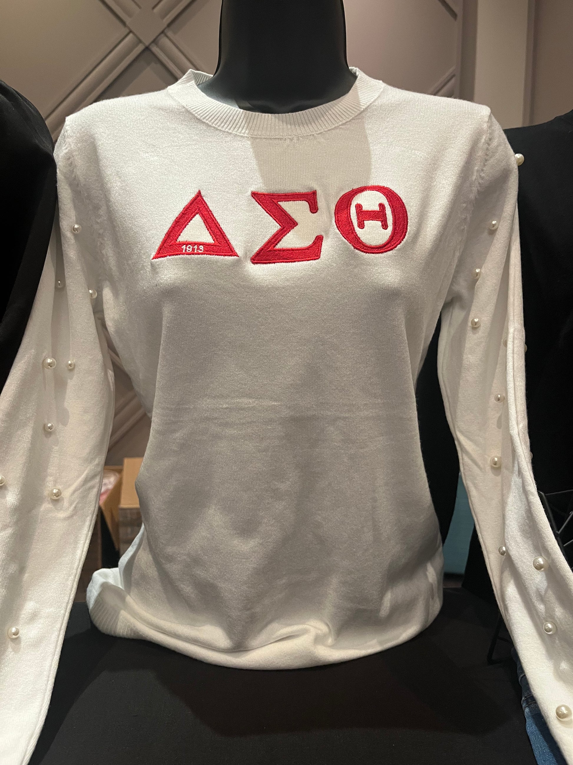 Lightweight Delta Sigma Theta sweater with a luxurious cashmere-like feel, breathable and comfortable for all-day wear. Easy-care design machine washable on delicate and hang dry perfect for stylish sorority-inspired layering.