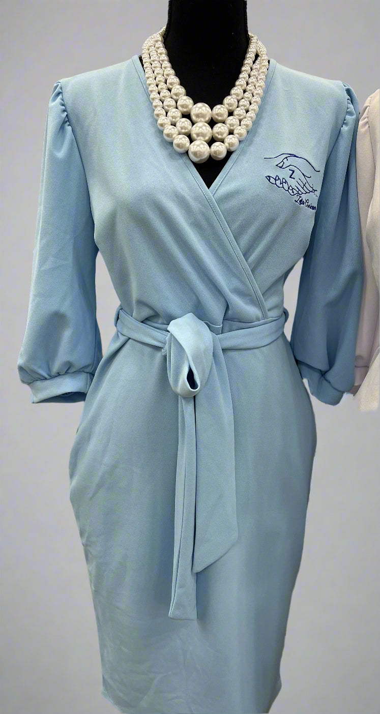 The Chloe is a faux wrap dress made from smooth, lightweight technocrepe fabric. It offers a flattering fit that works for any Amicae occasion. Finished with the Amicae hands symbol for the perfect touch of sisterhood.