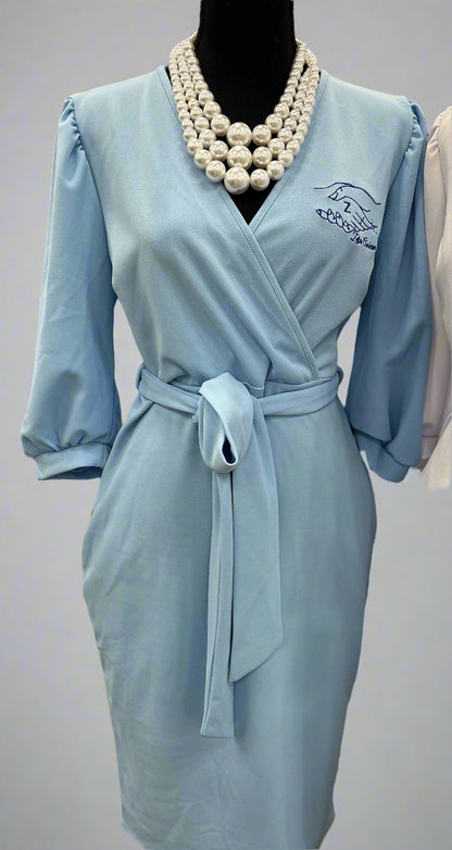 The Chloe is a faux wrap dress made from smooth, lightweight technocrepe fabric. It offers a flattering fit that works for any Amicae occasion. Finished with the Amicae hands symbol for the perfect touch of sisterhood.