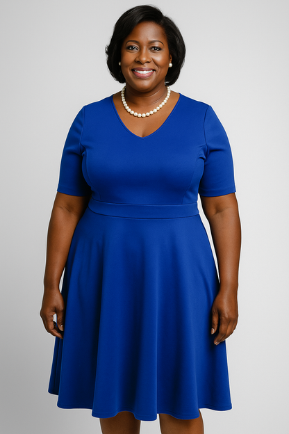 The Ebony dress offers a beautifully flattering semi–empire waist with an A-line design that suits every shape. Made from medium-weight scuba material, it smooths, holds, and forgives in all the right places. Finished with pockets and the Zeta Phi Beta shield over the heart.