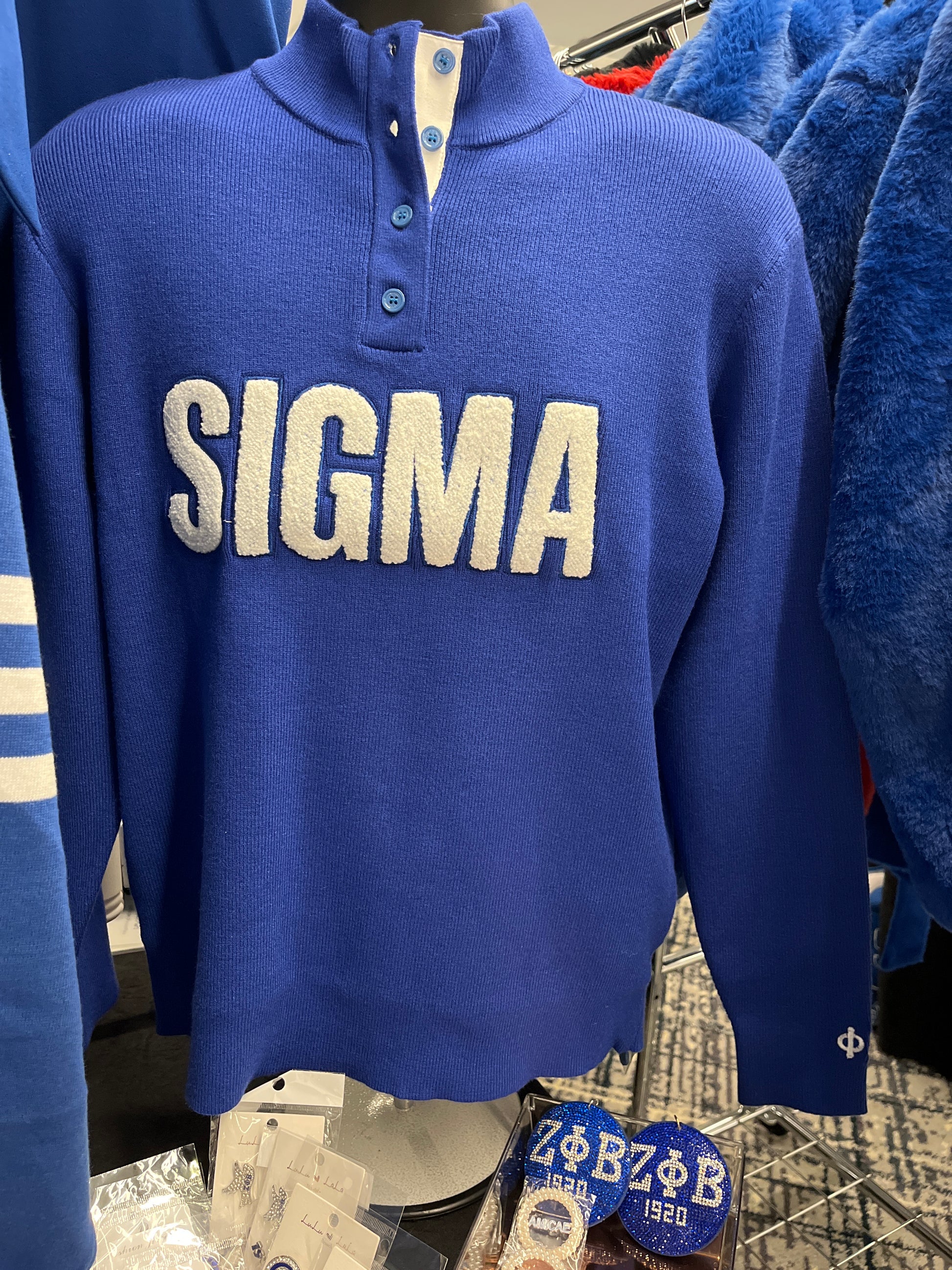 The Sigma Button Up is a classic sweater designed with a polished, clean look. Soft and easy to layer, it features traditional elbow patches for added style. A timeless piece for any Sigma man.