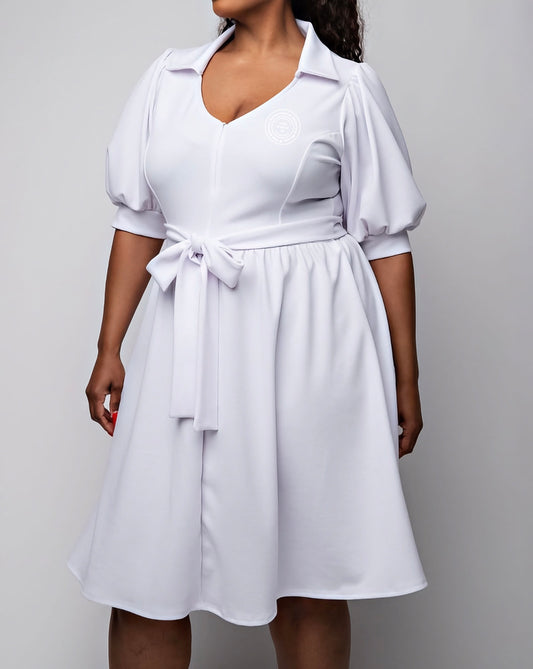 Elevate your look with The Snow White NAUW Style dress. This elegant white dress features the NAUW seal for a clean, classic Soror touch. Perfect for ceremonies, chapter events, or any occasion that calls for a polished, graceful look.