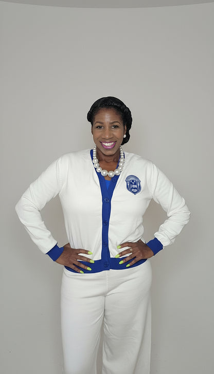 Woman wearing zeta phi beta white outfit with blue accents 
