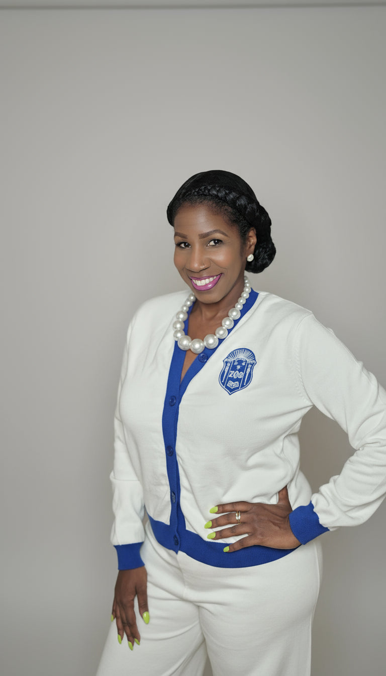Woman wearing zeta phi beta white outfit with blue accents 