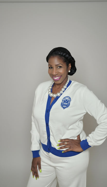 Woman wearing zeta phi beta white outfit with blue accents 
