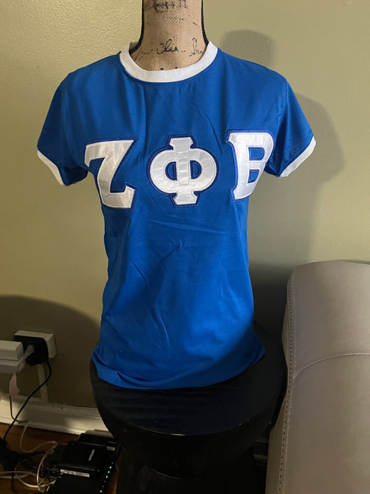 Classic Zeta Phi Beta traditional tee designed for everyday Greek pride. Made with minimal stretch for a structured fit recommended to size up for the best comfort. Perfect for casual wear, chapter events, or showing off your Zeta spirit in a clean, timeless style.