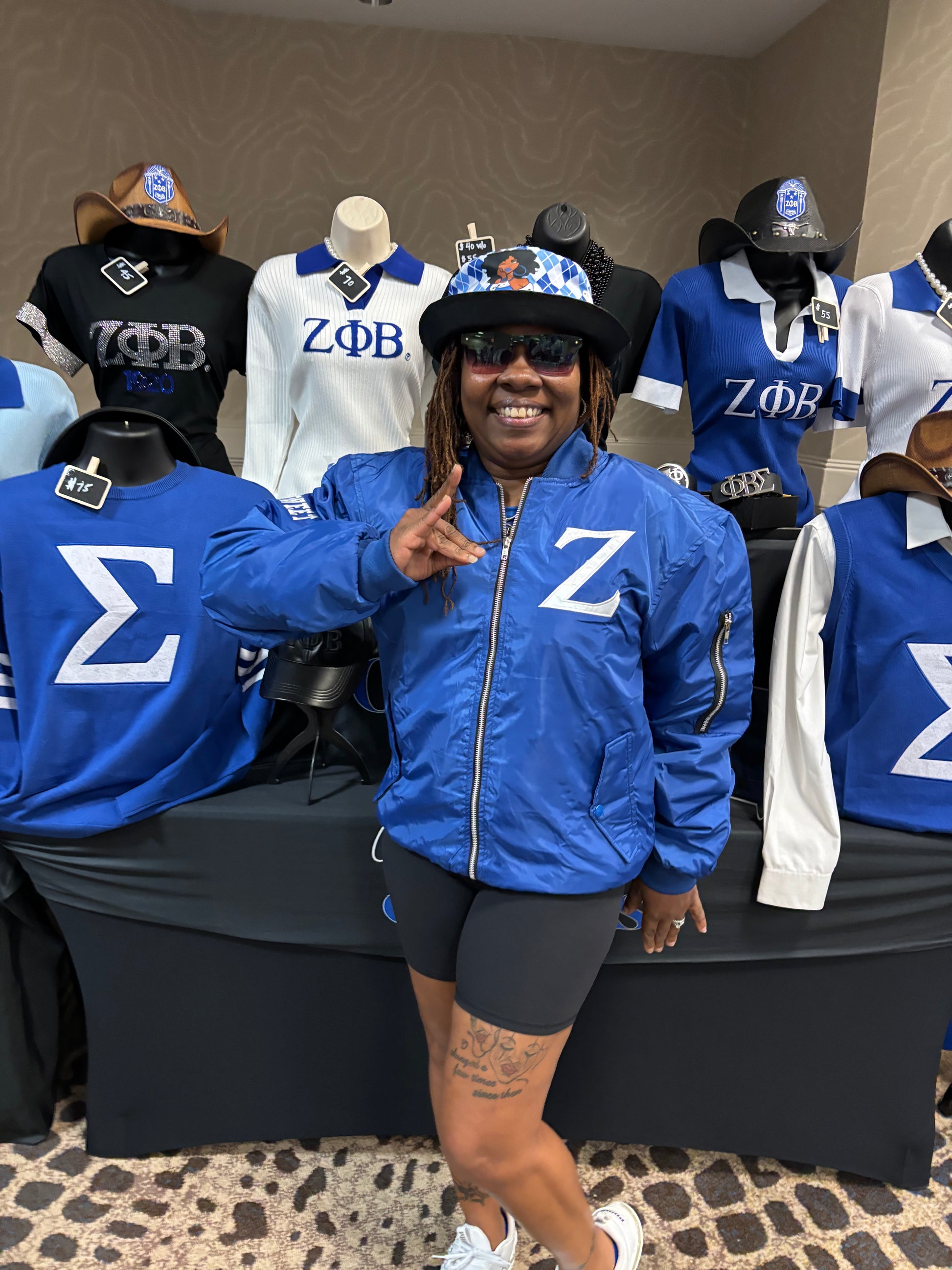  blue jacket with a 'Z' symbol and zippers