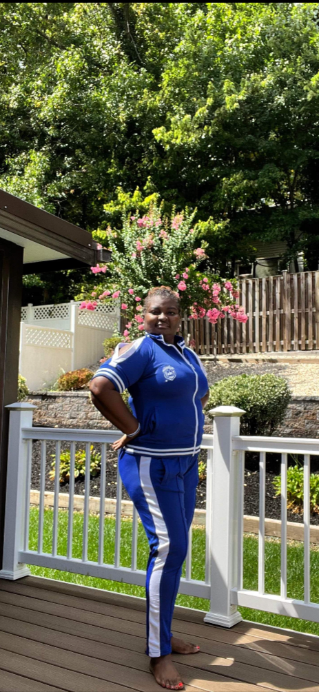 Stay stylish and comfy in the Cold Shoulder Jogger Pant Set. Featuring a short sleeve cold shoulder jacket with a sorority shield over the heart, this set blends casual and chic perfectly. Order one size up for the best fit. All sales final.