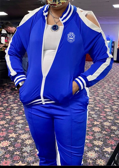 Step out in style with this Zeta embroidered cold shoulder jogger set. Soft, stretchy, and chic — perfect to dress up with heels or keep casual with sneakers.