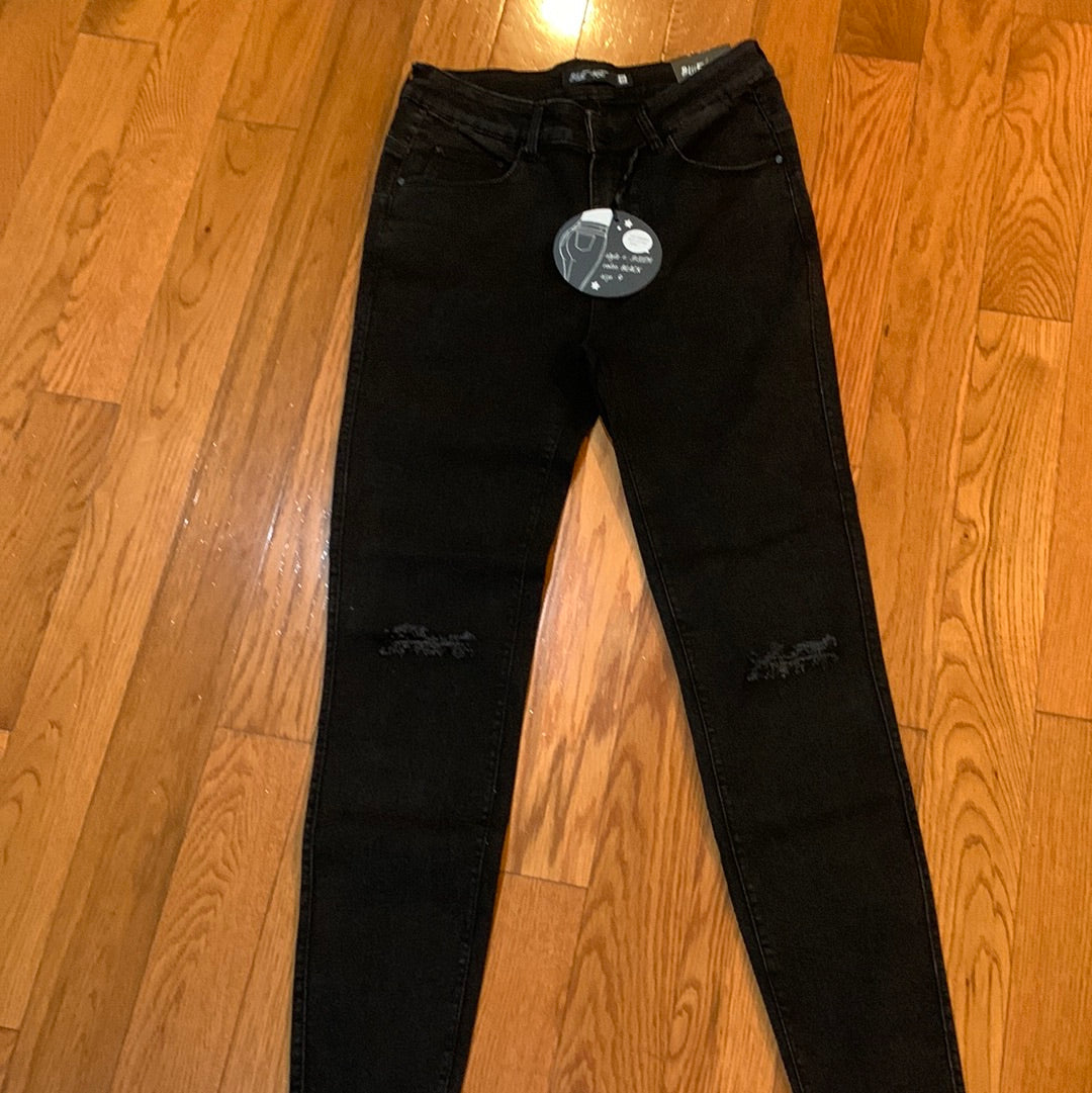 These Black Jeans with Distressed Knees bring the perfect balance of casual and edgy style. Designed with soft stretch denim, they offer a comfortable fit that moves with you while keeping their shape. The distressed knee details add just the right amount of flair, making them easy to dress up with heels or keep casual with sneakers. A must-have staple for any wardrobe, these jeans pair effortlessly with your favorite tops, jackets, and tees.