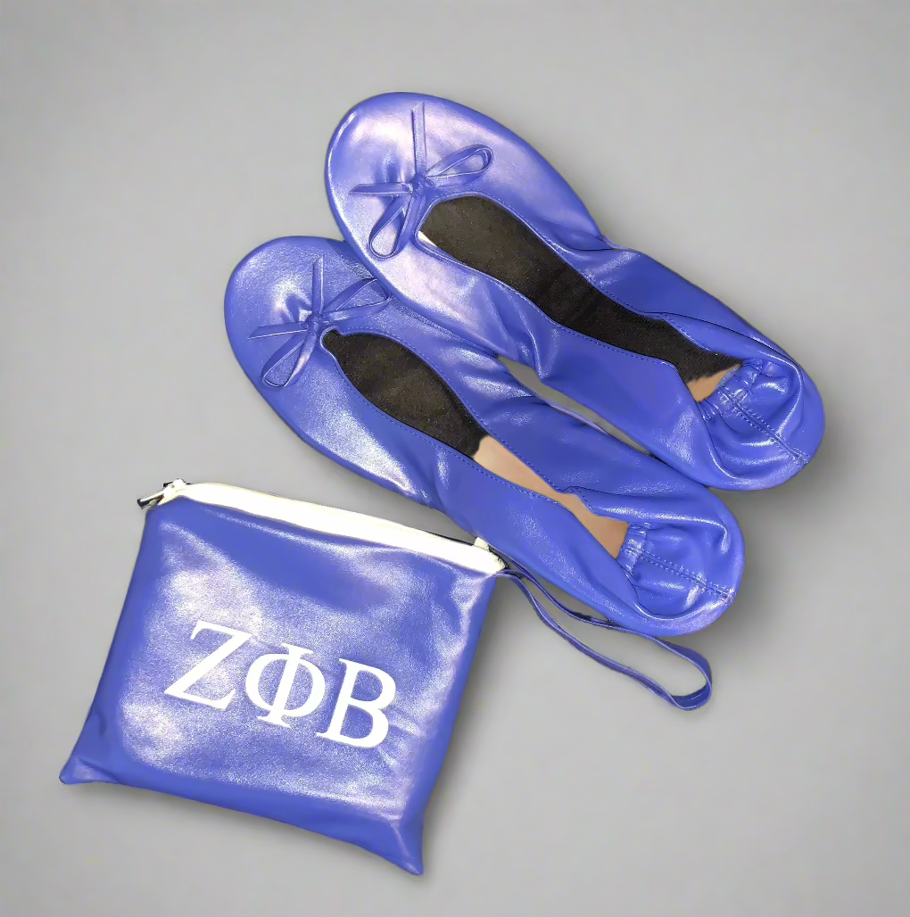 Flats The Zeta Way are designed for comfort, versatility, and subtle Zeta flair. The flats feature a lightly padded insole and flexible UV material that stretches for a perfect fit. The matching bag showcases the ZΦΒ design, while the shoes themselves remain plain allowing you to wear them anywhere with ease. Perfect for travel, events, or everyday wear, these flats combine comfort and sisterhood-inspired style.