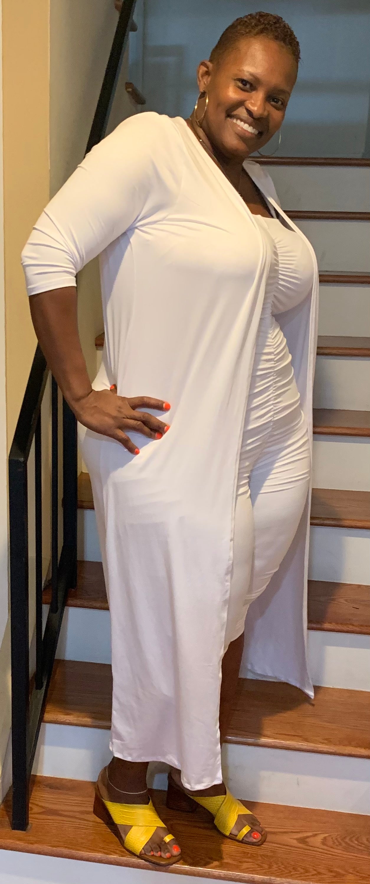 White two-piece set featuring a tube romper and matching duster detailed with a Zeta royal blue dove. Soft, stretchy, and effortlessly chic.