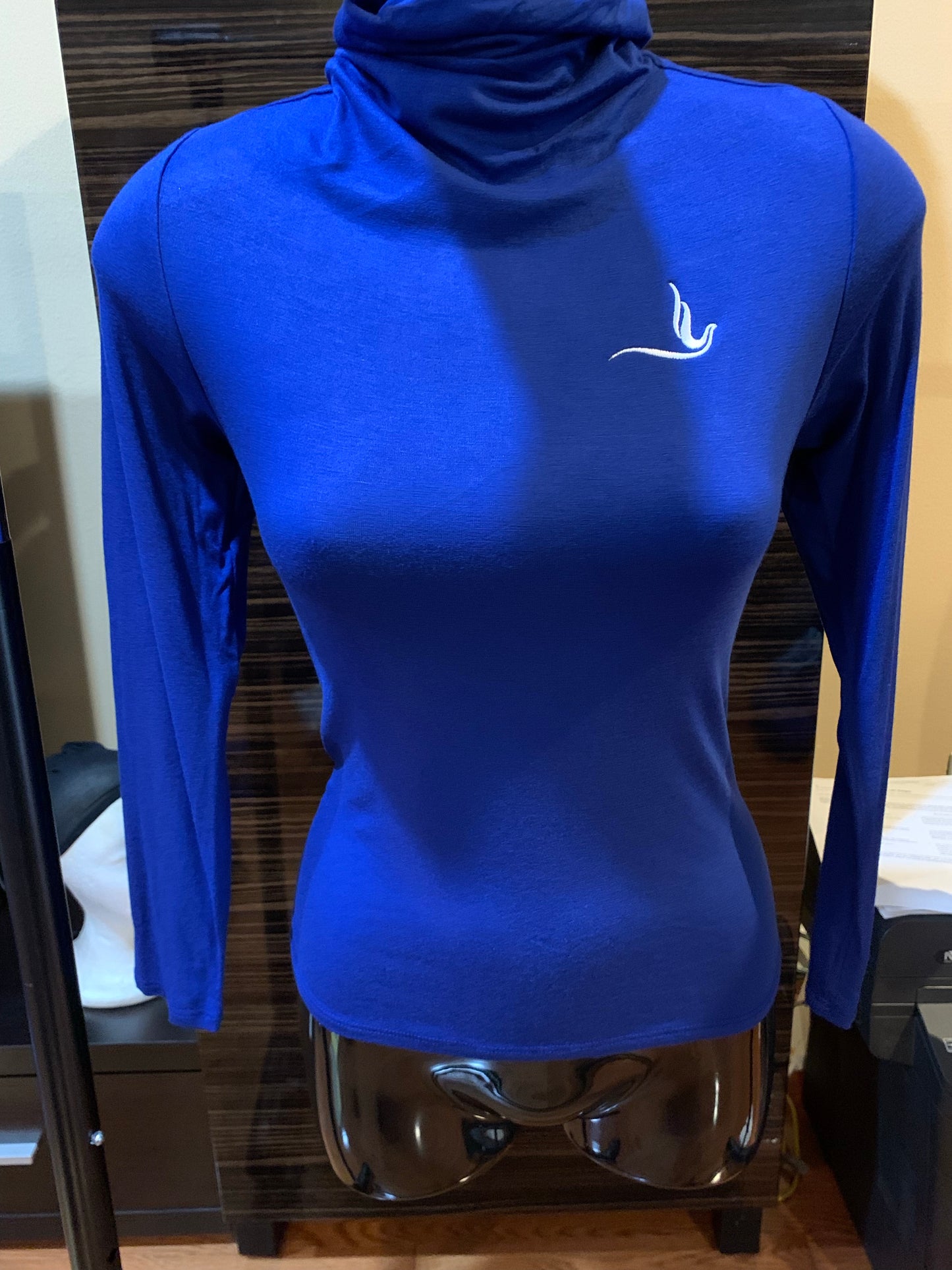 This thin royal blue turtleneck is a timeless piece designed with comfort and style in mind. Featuring the dove emblem on the left side, it’s the perfect blend of simplicity and sorority pride. The lightweight material makes it ideal for layering or wearing alone for a sleek, polished look.