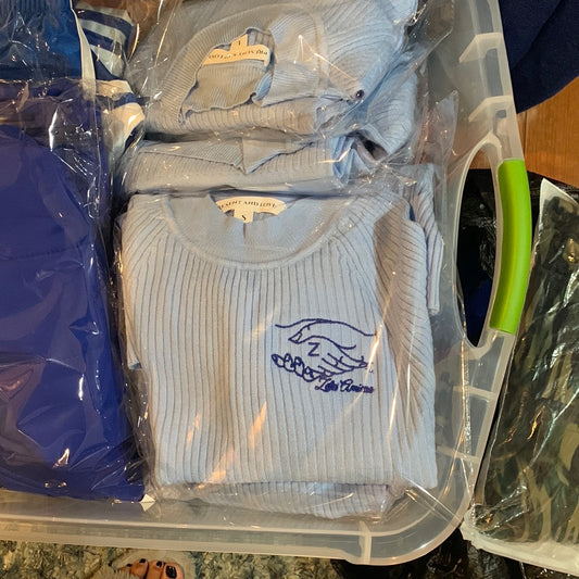 The Amicae Sweater is a beautifully crafted light blue ribbed knit that blends comfort, class, and sisterhood pride. Designed with soft, quality fabric, it offers a cozy yet flattering fit perfect for any occasion. The embroidered Amicae logo on the front adds a signature touch of elegance and unity. Whether you’re attending a chapter event, casual gathering, or just want to show your support in style, this sweater is a timeless piece you’ll love to wear.