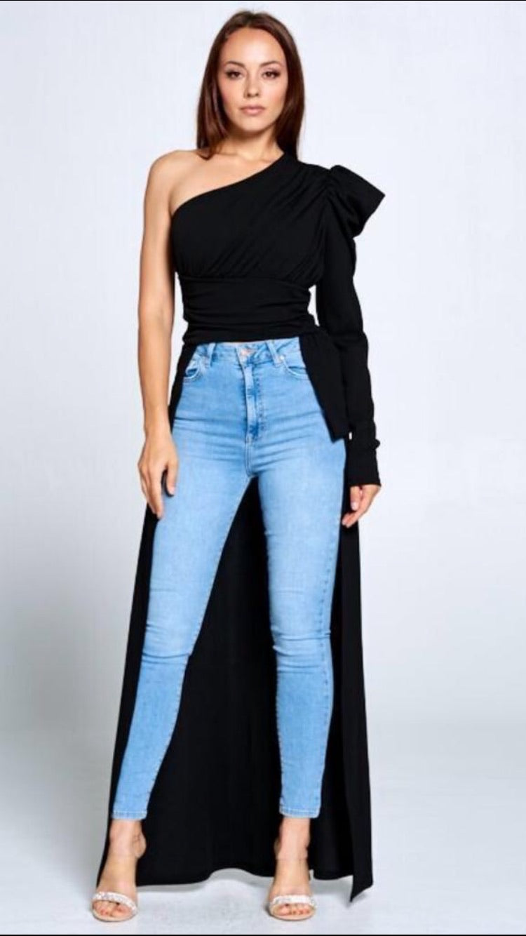 Make a statement in this elegant off-the-shoulder top. Flowy, dramatic, and easy to style with jeans, leggings, or a skirt. Available in royal blue and black.